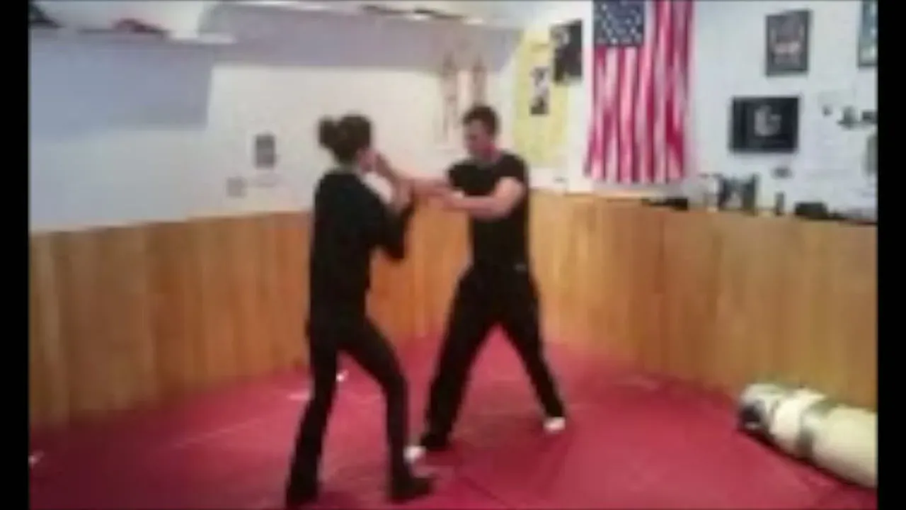 Two students sparring on the mats